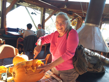 Cornelia Seckel helping out the waitstaff with her pumpkin carving skills at Nepenthe in Big Sur, CA